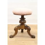Victorian carved walnut piano stool with circular revolving seat on carved and turned bulbous suppor