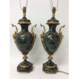 Pair of 18th century style gilt metal mounted verde antico marble table lamps, each of urn form with