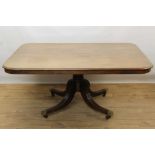 Regency mahogany breakfast table with rectangular tilt top on pedestal base with four splayed legs