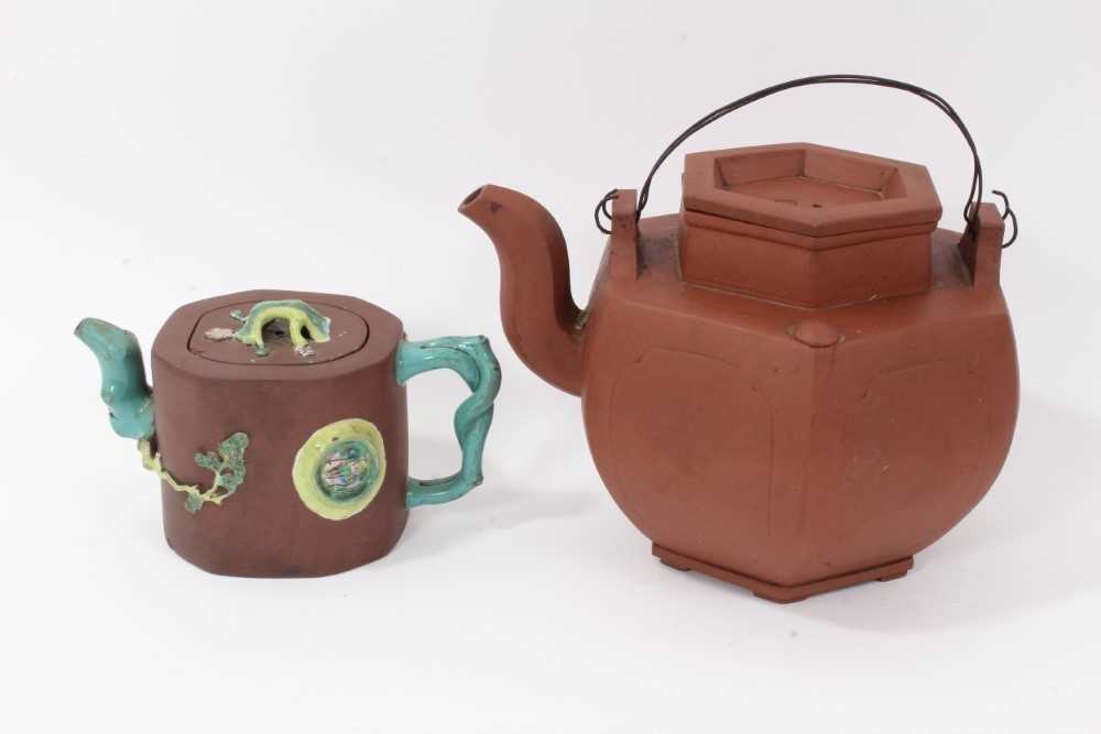 Two Chinese Yixing teapots, 19th/20th century, the first of hexagonal form, seal marks to cover and