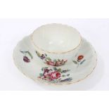 Worcester fluted tea bowl and saucer, circa 1772, polychrome painted with flowers, with gilt rims, t