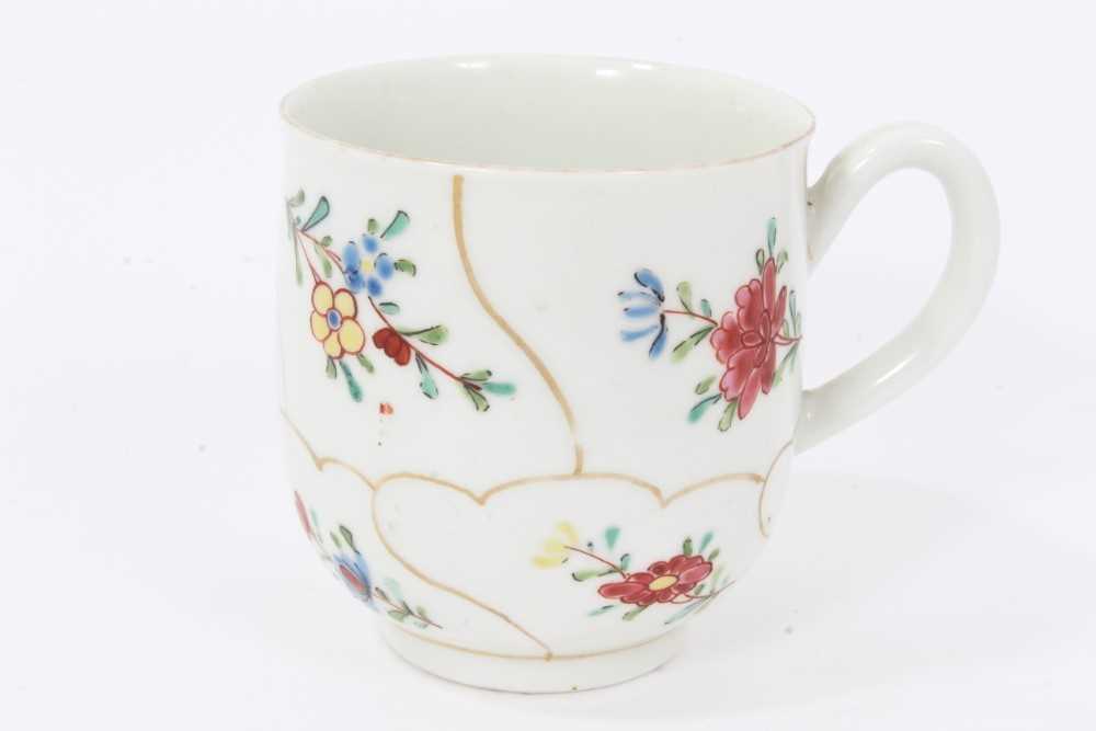 Worcester coffee cup, circa 1770, painted with flowers with wavy gilt borders, 5.75cm high