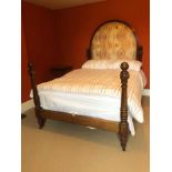 Victorian mahogany framed double bedstead, the upholstered arched headboard flanked by carved and tu