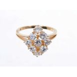 Diamond cluster ring with nine round brilliant cut diamonds in tiered claw setting on 18ct yellow go
