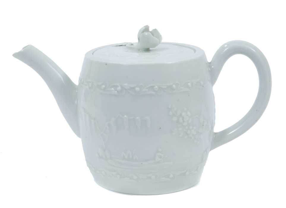 Worcester white-glazed teapot, circa 1760, of barrel form, decorated in relief with a Chinese fishin