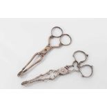 Pair of George III silver scissor action sugar nips, circa. 1760, 11cm overall, together with anothe