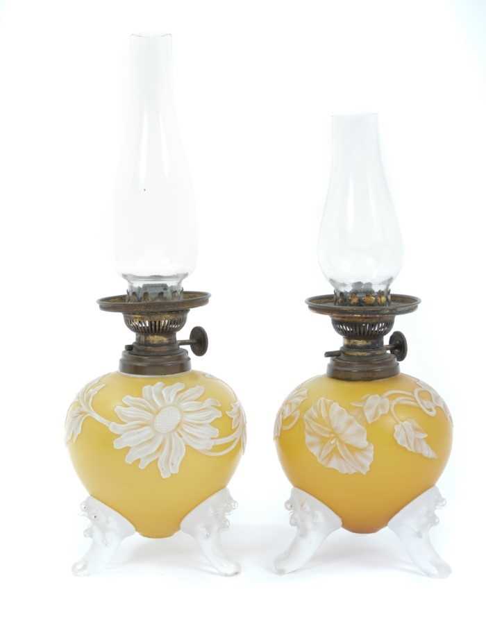 Rare pair of Victorian miniature oil lamps with overlaid glass in the manner of Thomas Webb & Sons