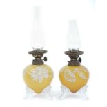 Rare pair of Victorian miniature oil lamps with overlaid glass in the manner of Thomas Webb & Sons