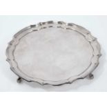 Contemporary silver salver with piecrust border on scroll feet, Asprey & Co Ltd London 1978