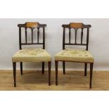 Pair of late 18th century Sheraton inlaid mahogany dining chairs, with shaped scroll top rail above