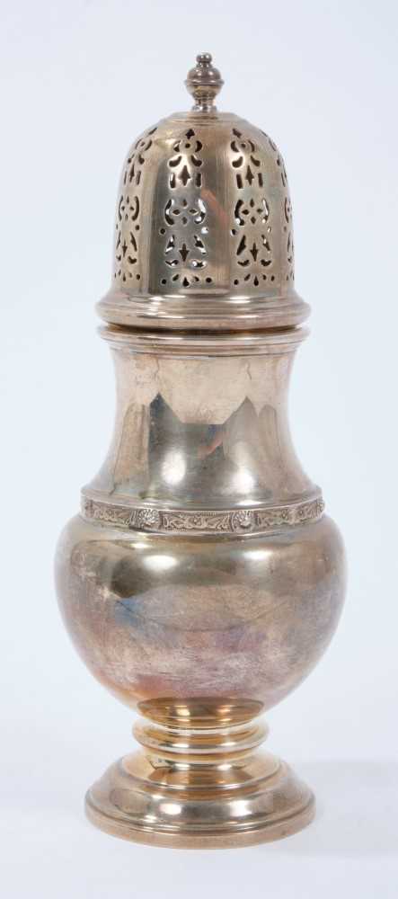 Contemporary silver sugar caster of baluster form, with pierced slip in cover