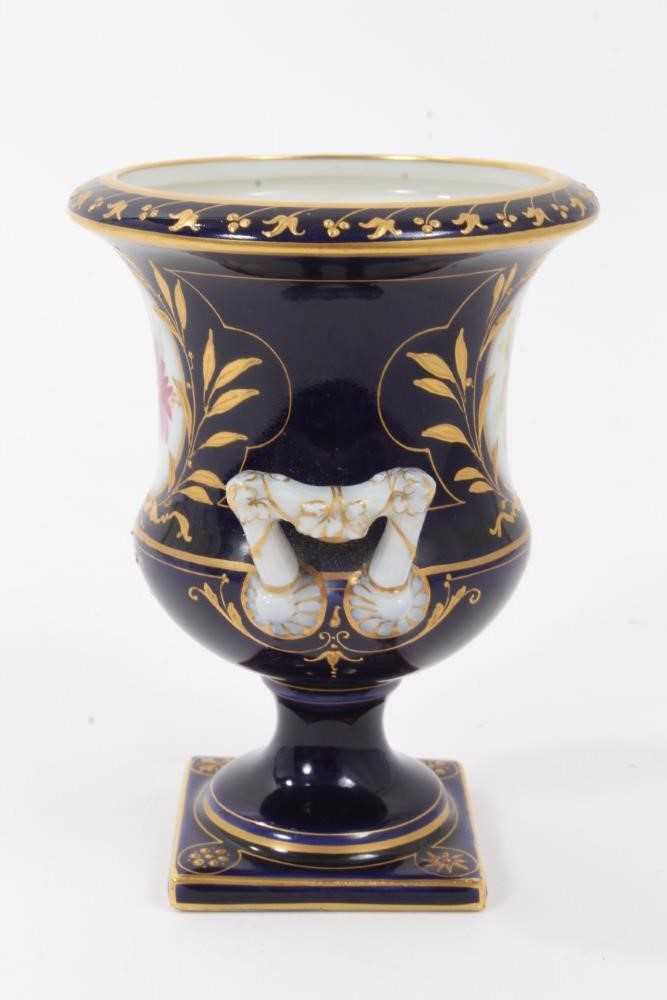 Small Berlin porcelain campana vase, circa 1880, painted with flowers on a gilt and cobalt blue grou - Image 2 of 7
