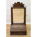 19th century walnut toilet mirror in the 18th century style, the rectangular mirrored plate above a