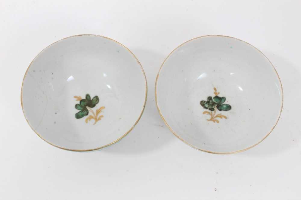 Pair of unusual Bow tea bowls, circa 1770, with pineapple moulding, turquoise borders, and flower at - Image 2 of 5