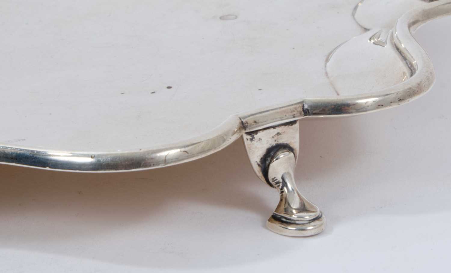 Early George V silver salver of shaped square form, with piecrust border, on four hoof feet - Image 3 of 3