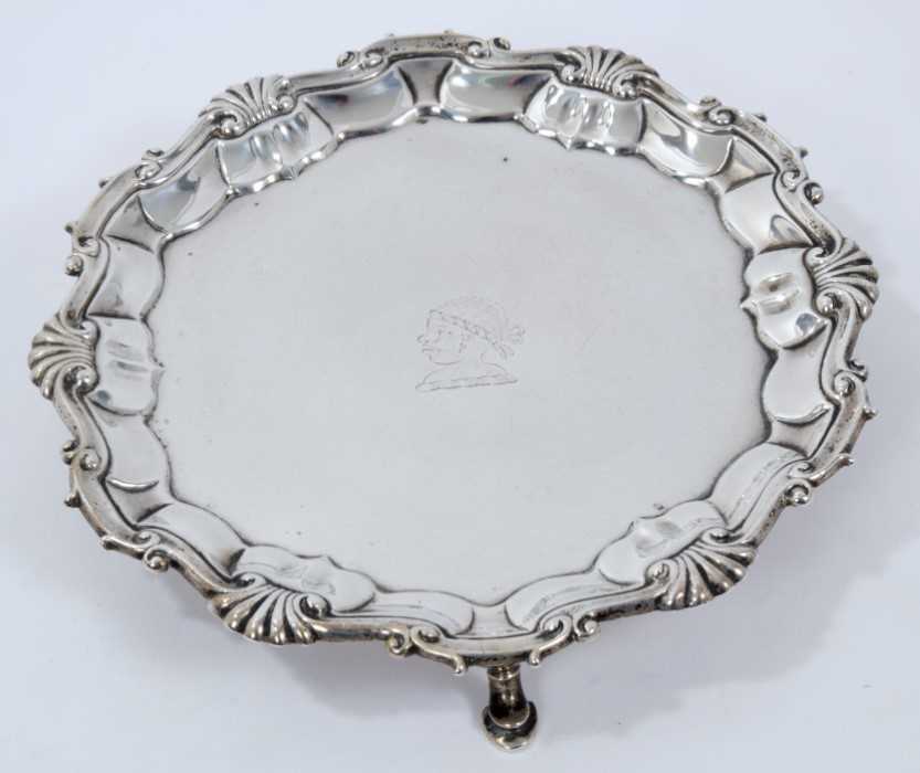George II silver waiter of circular with engraved armorial.