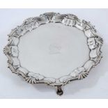 George II silver waiter of circular with engraved armorial.