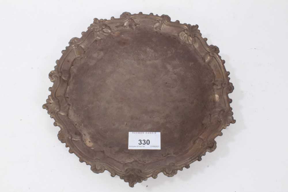 George III silver salver of hexagonal form, with piecrust and scroll border, on three scroll feet