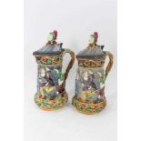 A matched pair of Minton Majolica 'Tower' jugs, 1881 and 1883, 33cm height