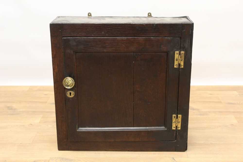 18th century oak hanging cupboard with three spice drawers and shelf enclosed by a panelled door wit