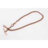 Edwardian 9ct rose gold watch chain with curb links, approximately 38cm.