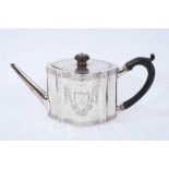 George III silver teapot of shaped form, with engraved foliate decoration