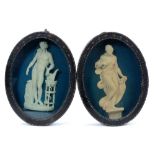 Pair of late 18th/early 19th century composition oval relief plaques depicting classical figures, in