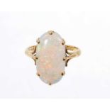 Opal single stone ring with an oval opal measuring approximately 18.5mm x 10mm on 18ct yellow gold s