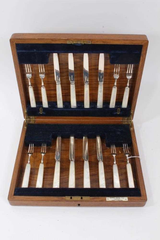1920s dessert set of eights pairs of knives and forks with silver blades and mother of pearl handles