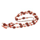 19th century Chinese carved coral bead and carved hediao nut necklace