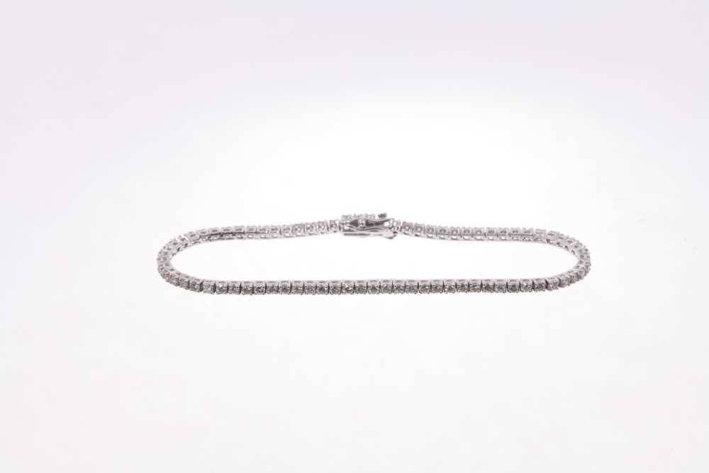 Diamond tennis bracelet with a line of brilliant cut diamonds in 18ct white gold setting. Estimated