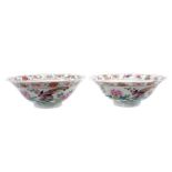 Pair of Chinese famille rose porcelain bowls, c.1900, decorated with tropical birds, flowers and aus