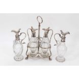 George III silver 3 bottle cruet frame of trefoil form, with a pair of bottles and two others