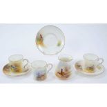 Group of Royal Worcester porcelain, three coffee cups and saucers and a posy vase