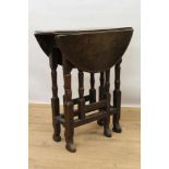 Small late 17th / early 18th century oak gateleg table on turned supports joined by stretchers on s