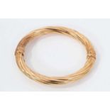 9ct yellow gold hinged bangle with spiral twist design