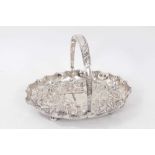 Edwardian silver swing handled dish of oval form, with shaped shell border