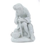 Bow blanc de chine figure, circa 1755, in the form of a seated elderly man warming his hands on a br