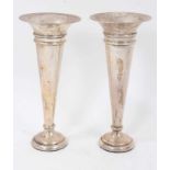 Pair early George V silver trumpet vases of inverted conical form on circular pedestal bases