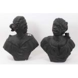 Rare pair of early carved stone niche busts of an African man and woman, pierced to underside of bas
