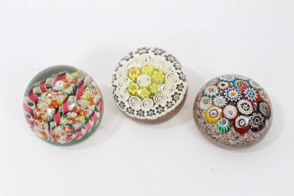 Three 20th century cane paperweights, including one Murano