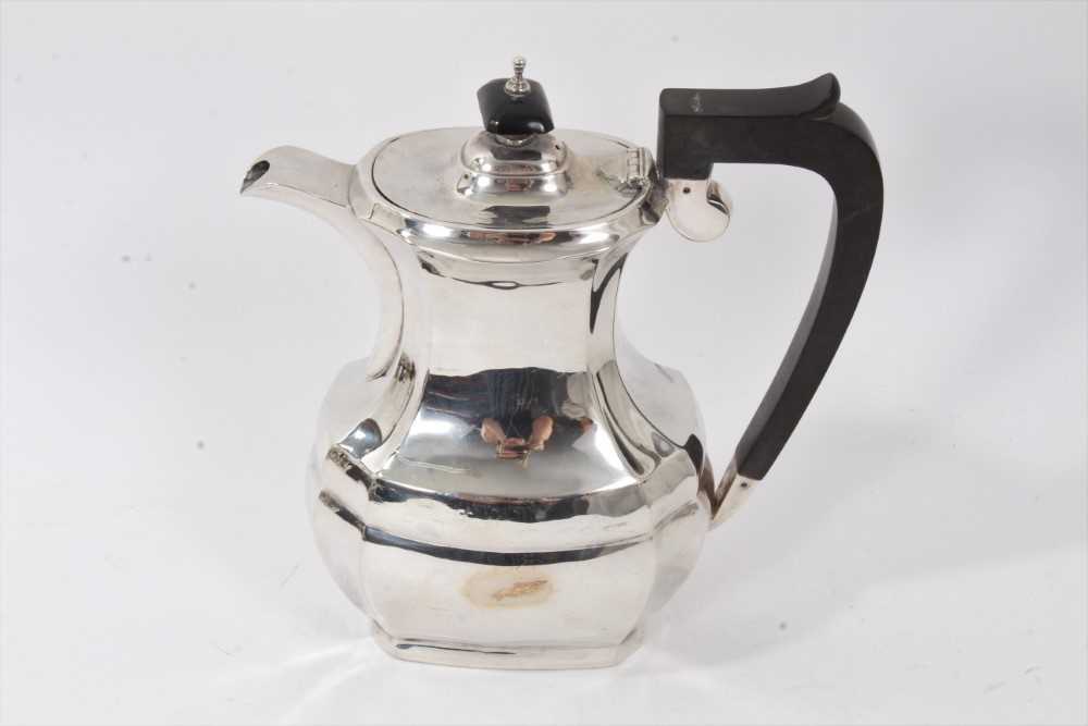 1930s silver coffee pot of facetted baluster form.