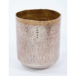 Contemporary silver tumbler cup with spot hammered finish and silver gilt interior and external rim