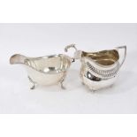 Silver sauceboat together with a cream jug