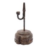 18th century wrought iron nip rush light holder, raised on circular oak base