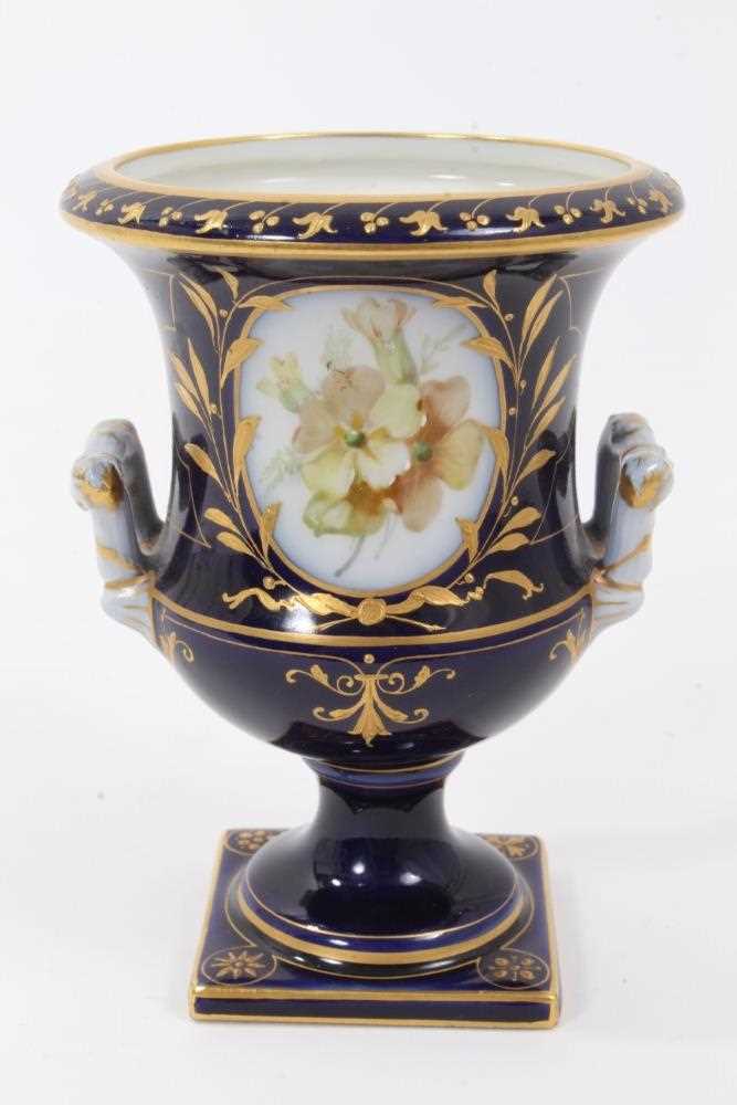 Small Berlin porcelain campana vase, circa 1880, painted with flowers on a gilt and cobalt blue grou - Image 3 of 7