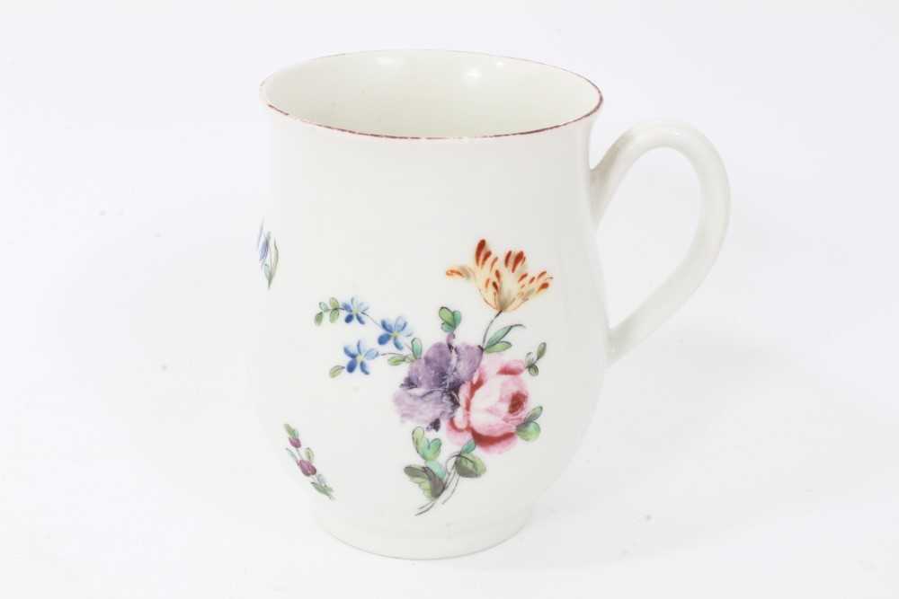Derby baluster shaped mug, circa 1760, polychrome painted with floral sprays, red painted rim, 10cm