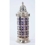 Edwardian silver sugar caster of cylindrical form, with pierced decoration and blue glass liner