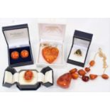 Group of amber jewellery to include a gold and amber necklace with free form amber beads, an amber h