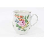 Worcester mug, circa 1760, of small baluster form, polychrome painted in the Rogers style with flowe